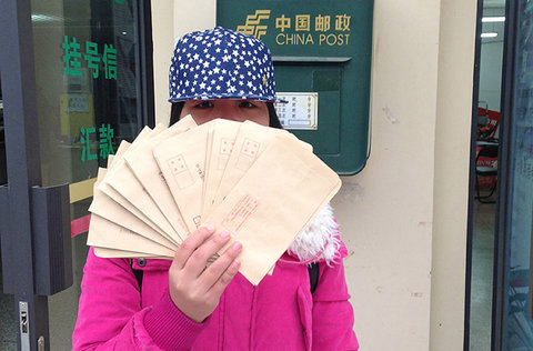 An activist in Yunnan Province prepares to mail letters to her local government complaining of illegal gender discrimination by Chinese companies.